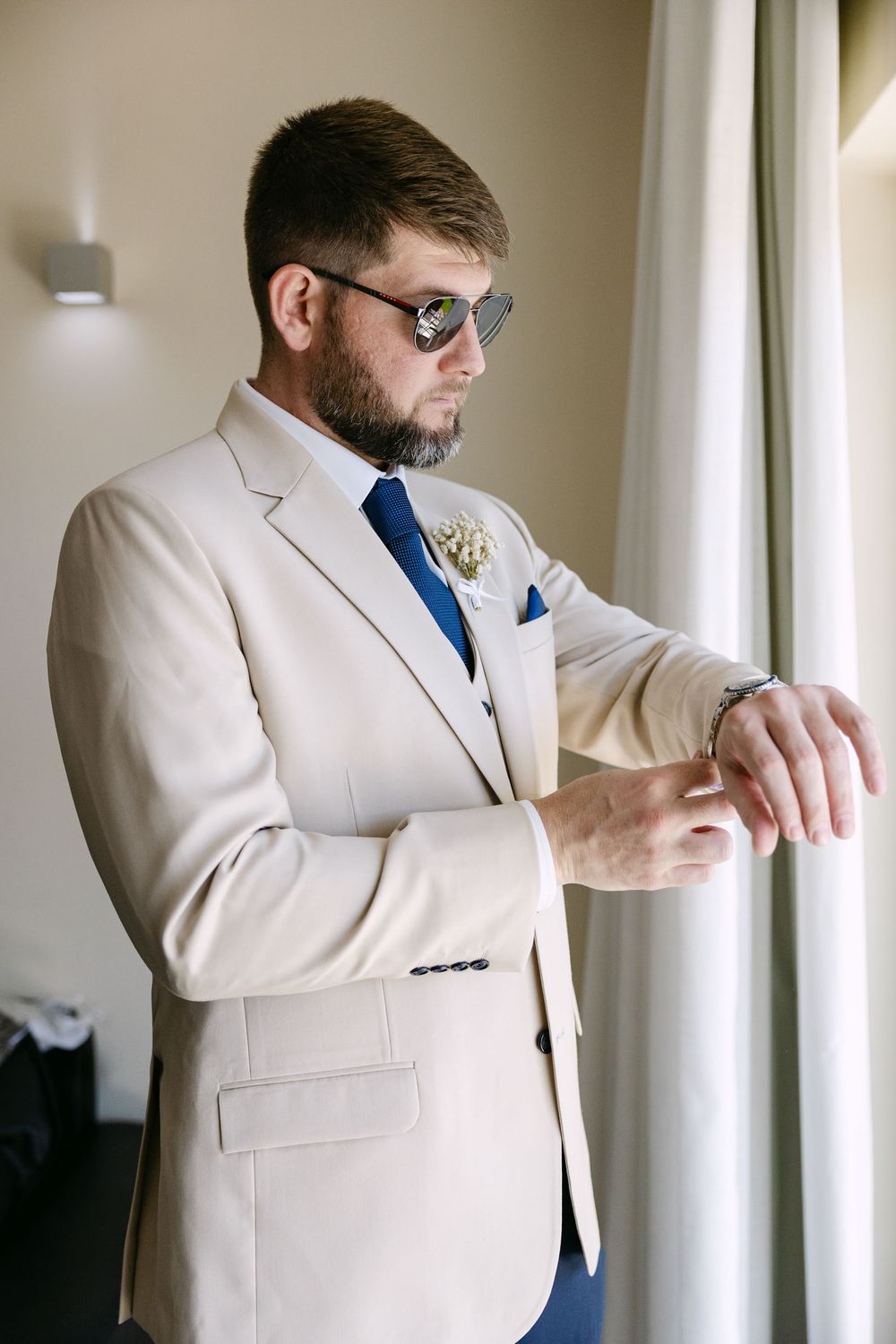 Groom getting ready at hotel in Albufeira before ceremony