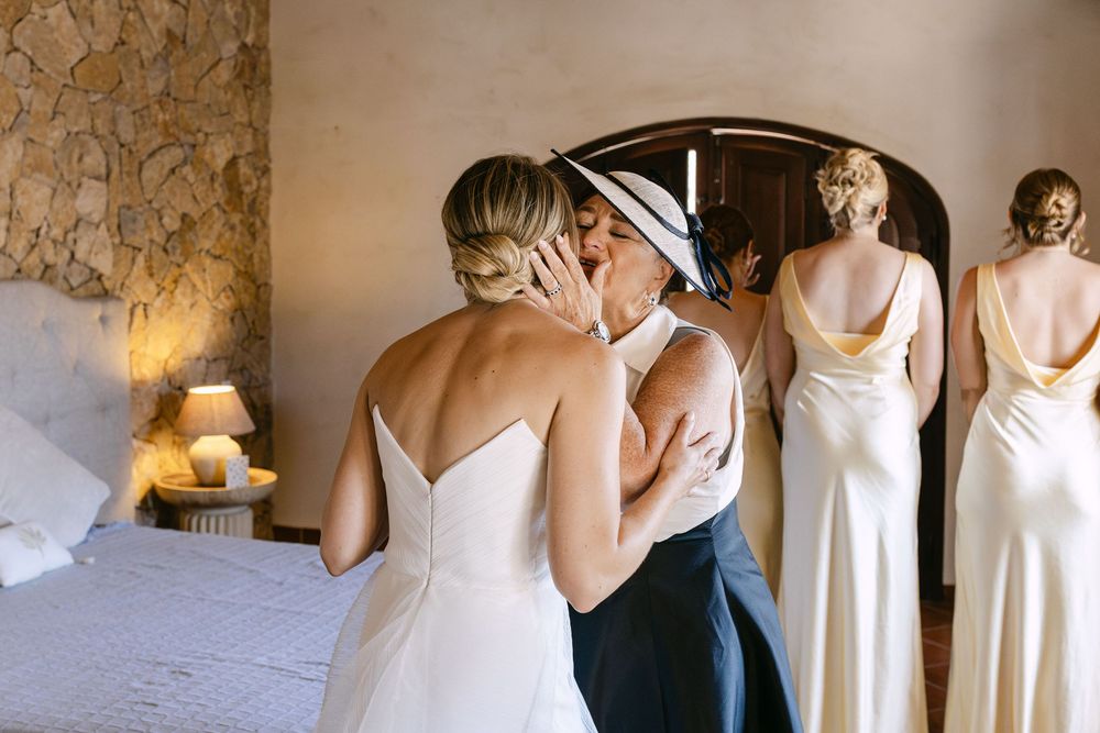 bride kissing her mother during bride preparations in monte do serrinho