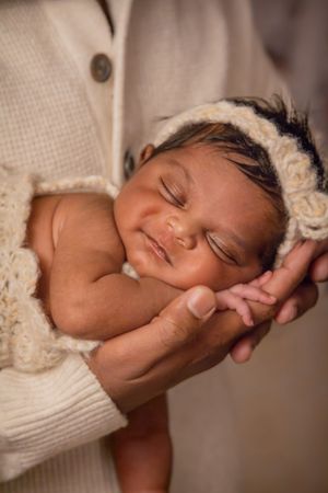 newborn session sleeping baby baby in dad's hand