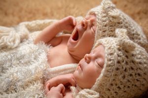 twin girl newborn session with boho setup and handmade outfits