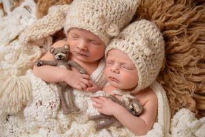 twin girl newborn session with boho setup