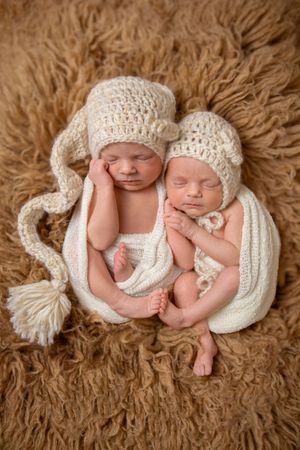 twin girl newborn session with boho setup
