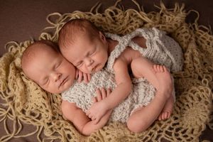 twin girl newborn session with boho setup