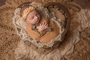 boho newborn session Mississauga baby girl in heart prop
