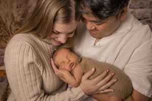 newborn session mississauga new parents holding son