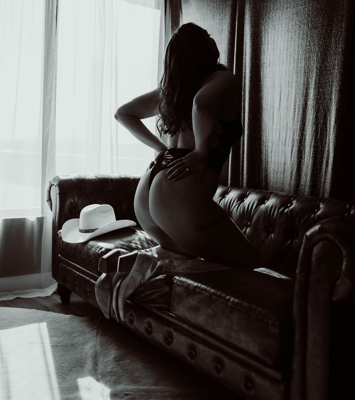 Wisconsin boudoir photographer is Boudoir by KJ who uses dark and moody lighting.