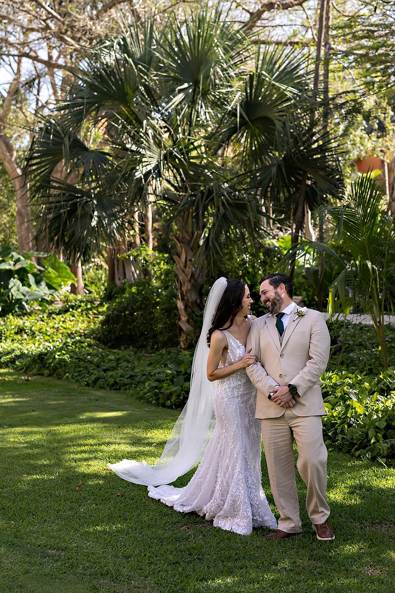 Emotional first look moment during Riviera Maya destination wedding at Barceló Maya Grand Resort.