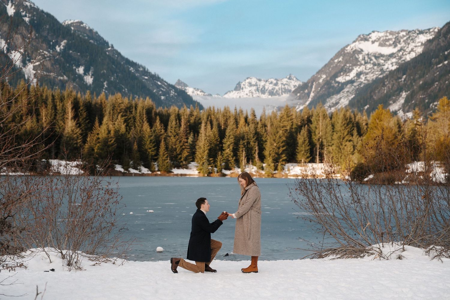 A series of panoramic photos showing a snowy mountain proposal scene at a scenic lake with snow-capped peaks.