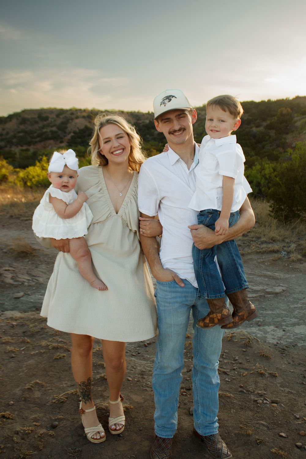Family of four during a family photo session at Palo Duro Canyon State Park in Canyon, Texas