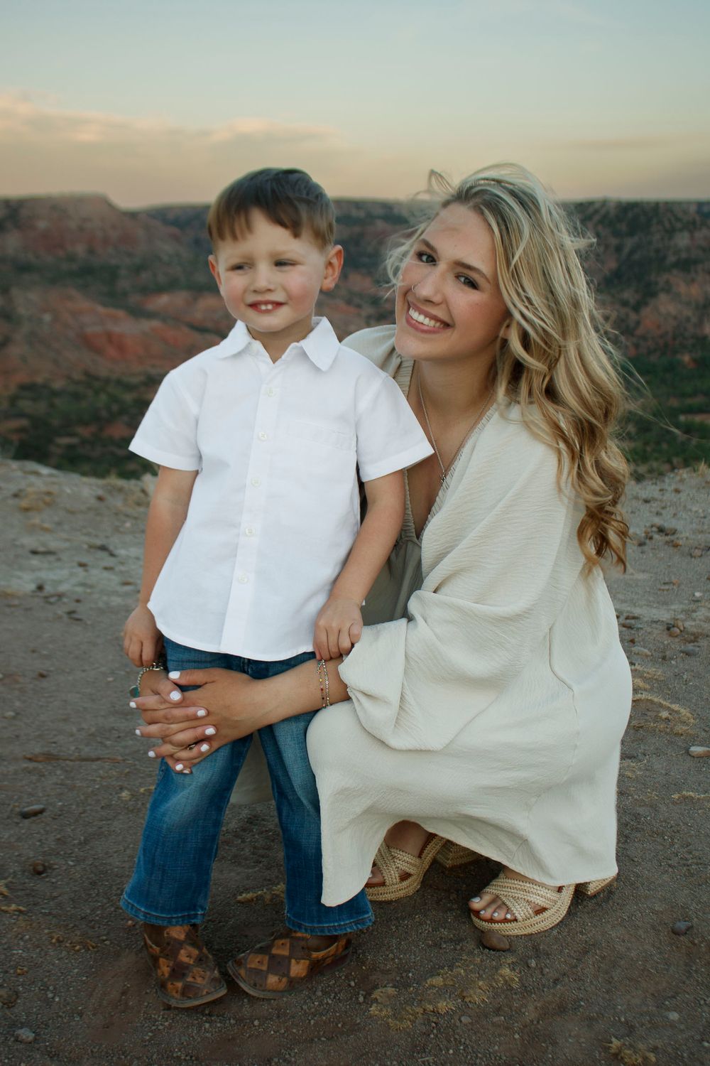 A young mother with her son during a family photo session at Palo Duro Canyon State Park in Canyon, Texas