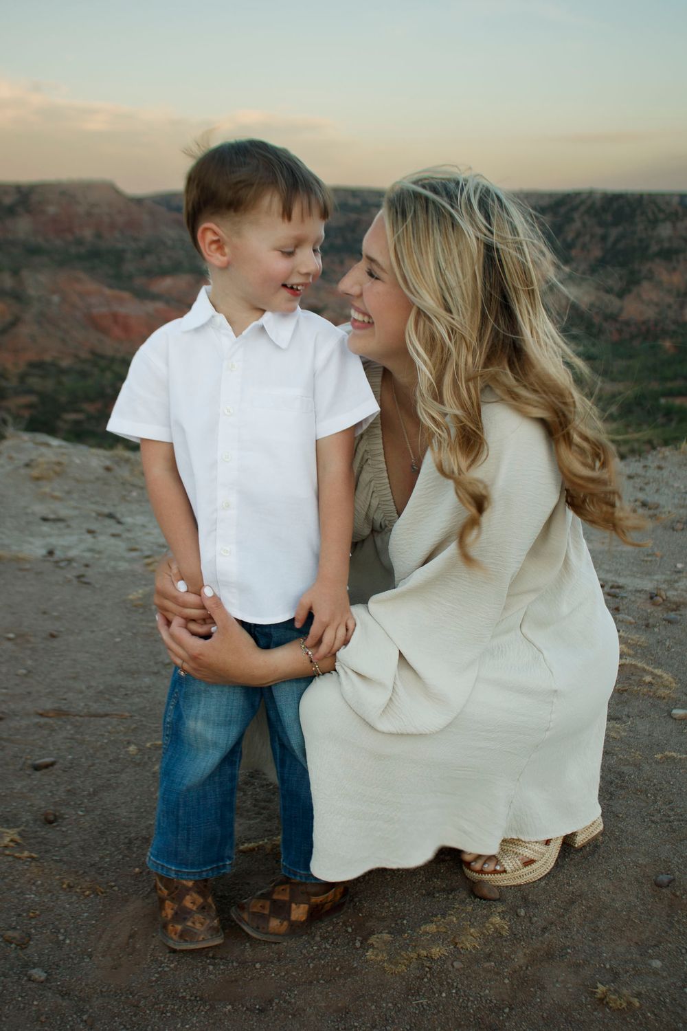 A young mother with her son during a family photo session at Palo Duro Canyon State Park in Canyon, Texas