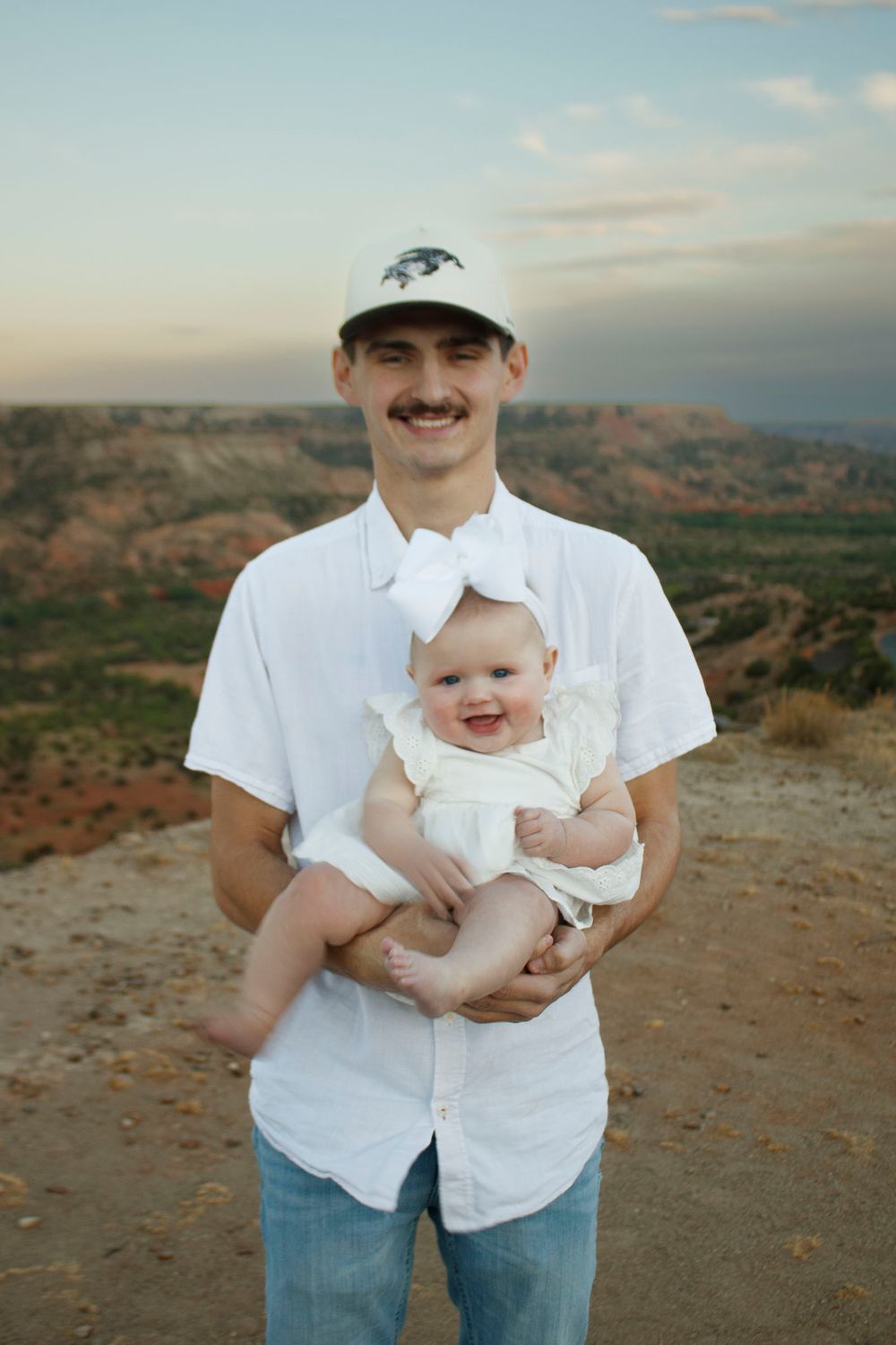 A young father and his daughter during a family photo session at Palo Duro Canyon State Park in Canyon, Texas