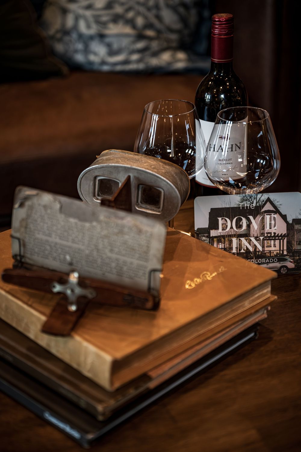 Detail shot of a wine bottle and glasses in the luxury boutique hotel The Dove Inn in Golden, CO.