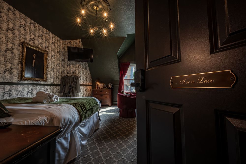 Detail shot of a door opening into the Iron Lace room at the luxury boutique hotel The Dove Inn in Golden, CO.