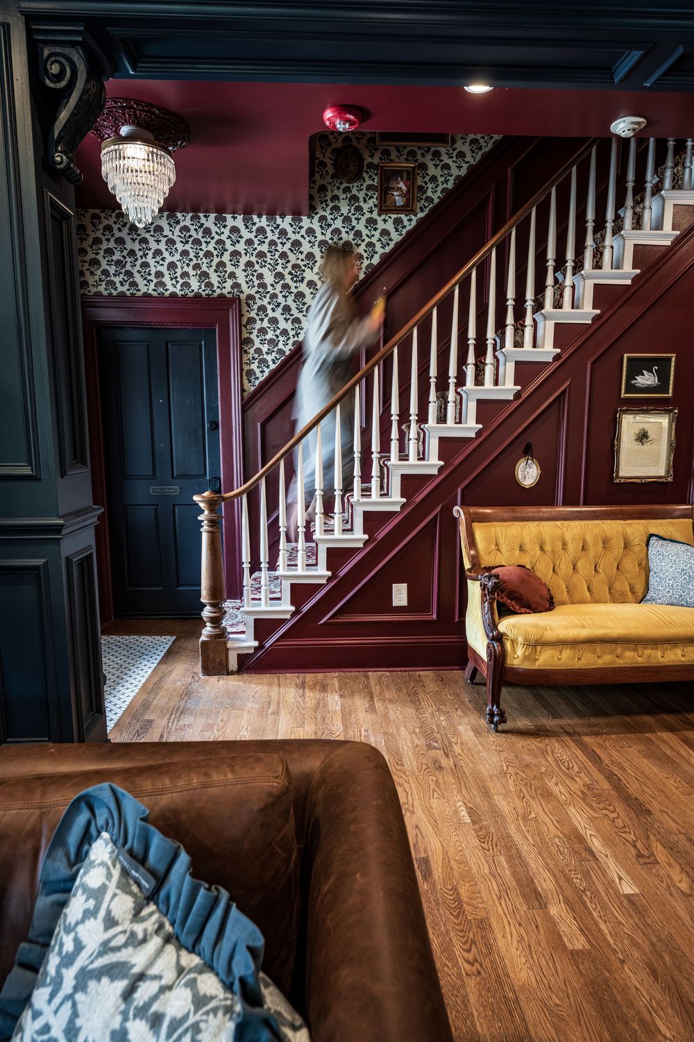 Long exposure of a woman walking up the stairs at the luxury boutique hotel, The Dove Inn in Golden, CO.