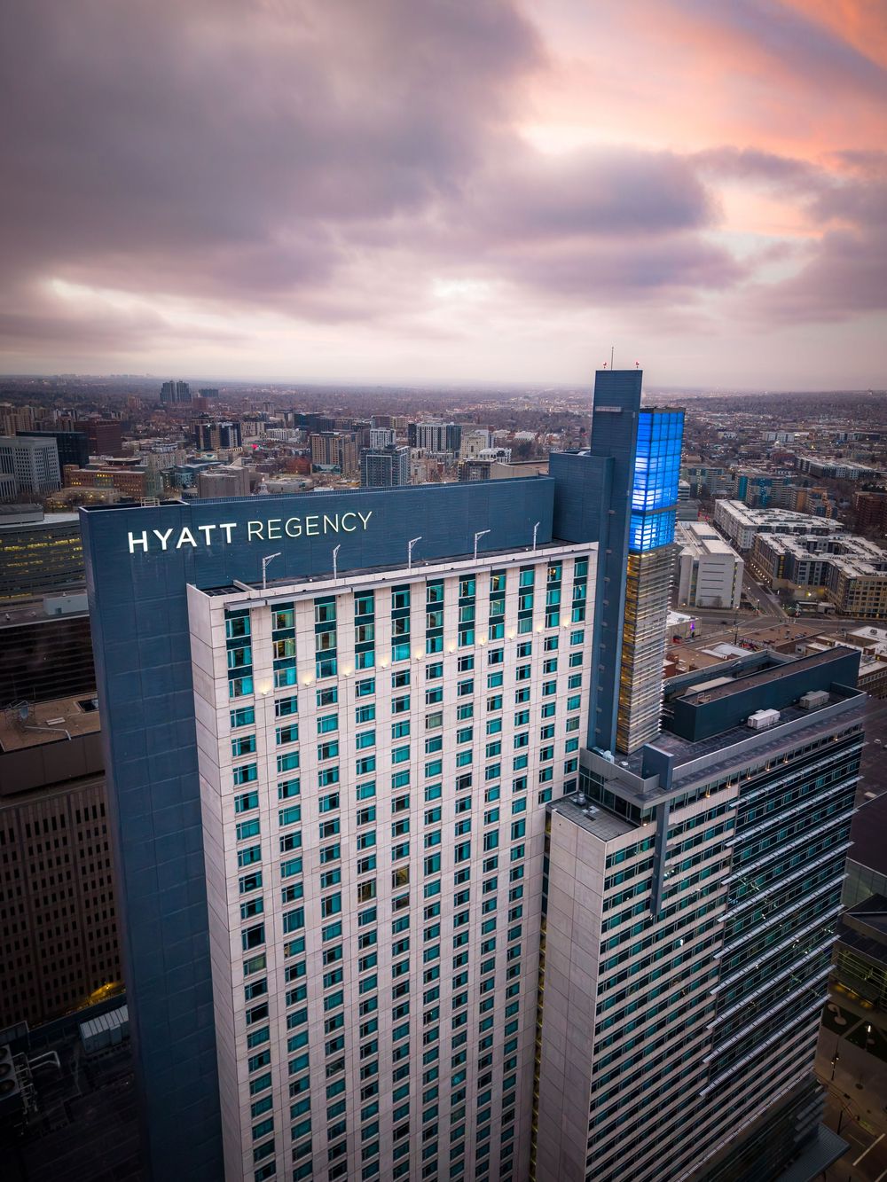 Aerial shot of the Hyatt Regency Denver at sunrise by Denver Hospitality, Travel & Tourism photographer Captain Colorado Photography.