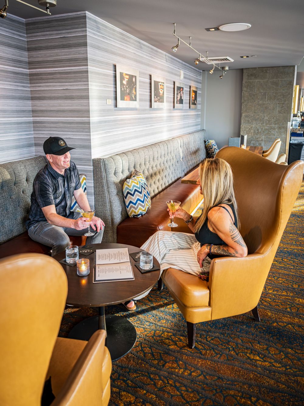 A couple enjoying cocktails at Peaks Lounge by Denver Hospitality, Travel & Tourism photographer Captain Colorado Photography.
