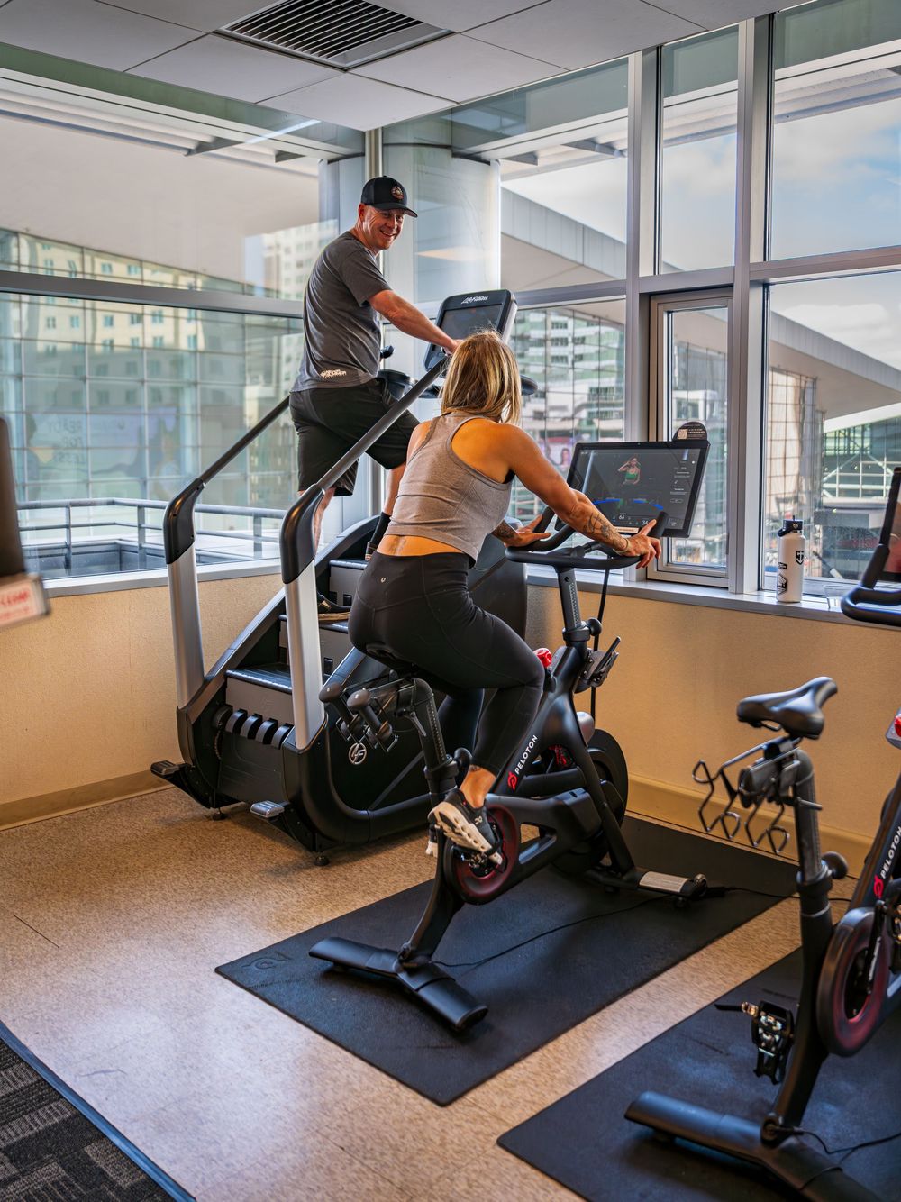 A couple exercising at the gym in Hyatt Regency Denver by Denver Hospitality, Travel & Tourism photographer Captain Colorado Photography.