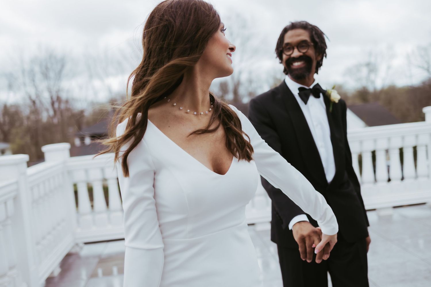Bride and groom, wedding holding hands at Holliday Farms in Zionsville, Indiana