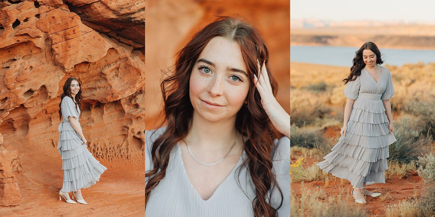 Young woman in a gray tiered dress poses gracefully in a stunning red rock desert landscape near a lake.