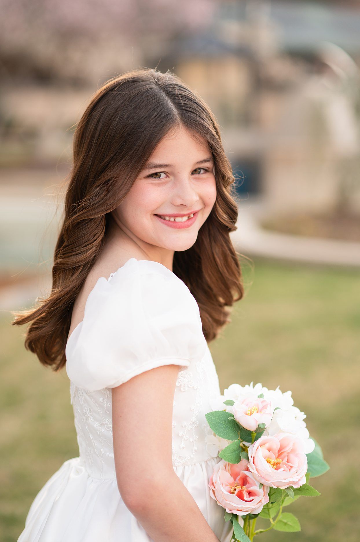 Religious Milestone Baptism portraits for 8 Year old Girl in Downtown Bartlesville at the Conoco Plaza by Bartlesville Photographer Kristi B