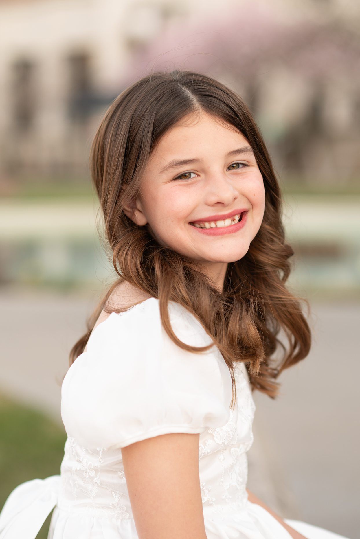 Religious Milestone Baptism portraits for 8 Year old Girl in Downtown Bartlesville at the Conoco Plaza by Bartlesville Photographer Kristi B