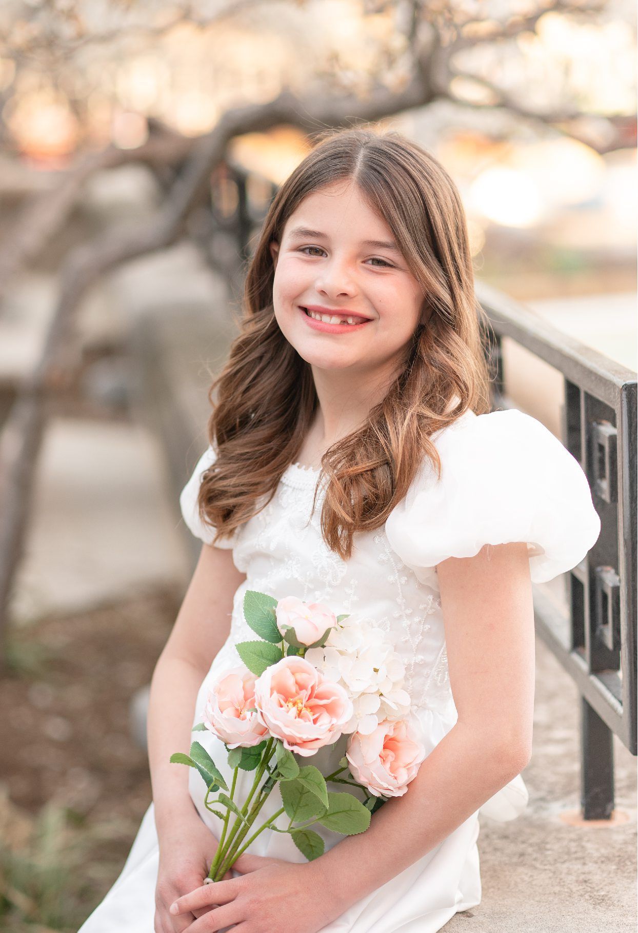 Religious Milestone Baptism portraits for 8 Year old Girl in Downtown Bartlesville at the Conoco Plaza by Bartlesville Photographer Kristi B