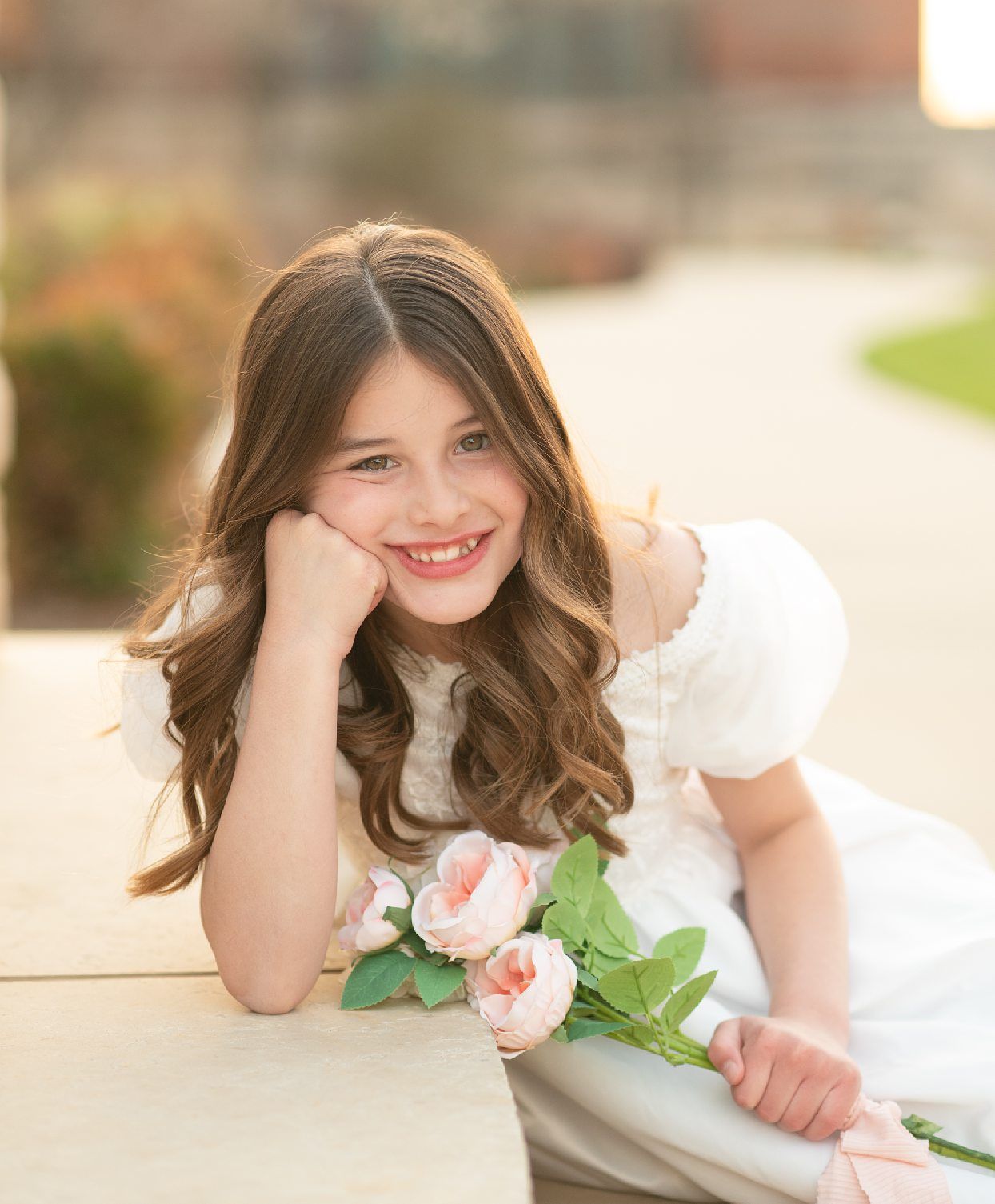 Religious Milestone Baptism portraits for 8 Year old Girl in Downtown Bartlesville at the Conoco Plaza by Bartlesville Photographer Kristi B