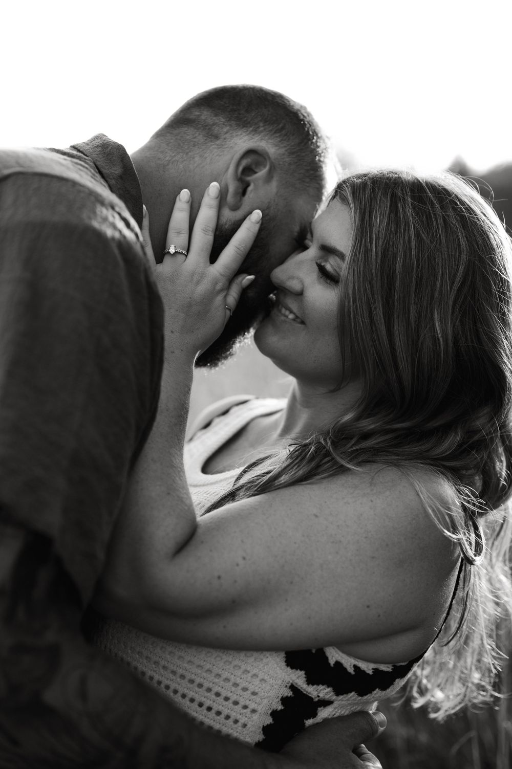 A series of intimate black and white photographs showing a romantic couple during tender moments of affection.