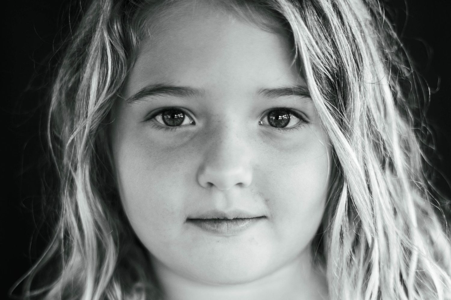 Happy child enjoying outdoor school portrait session on the Space Coast.