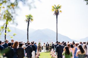 Romantic island wedding at Hotel Villa Emden on Isole di Brissago with palm trees, lake views, and Italian-style architecture.
