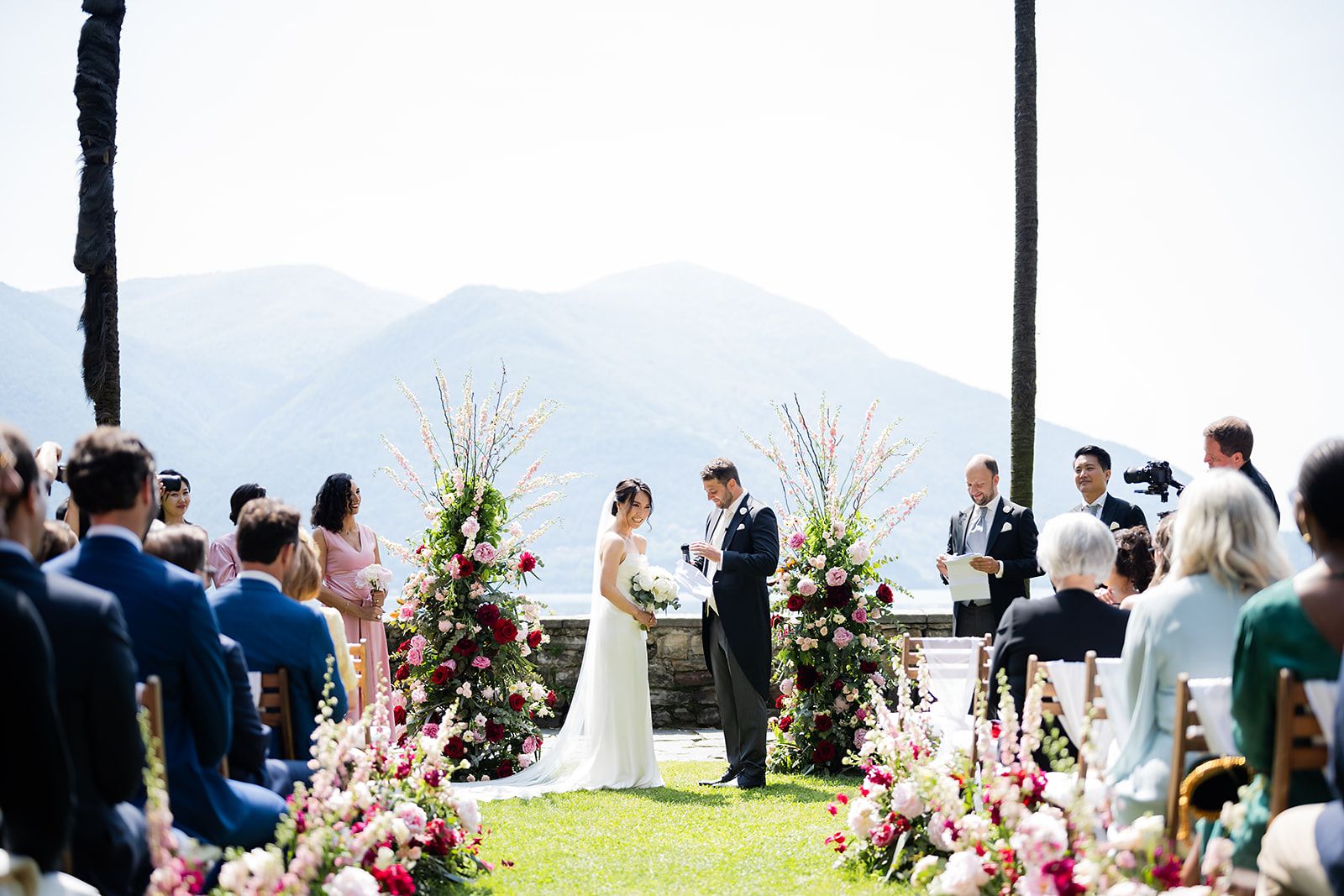 Romantic island wedding at Hotel Villa Emden on Isole di Brissago with palm trees, lake views, and Italian-style architecture.