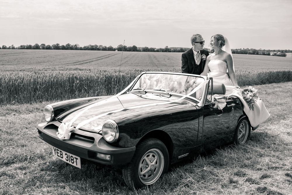 SUFFOLK WEDDING PHOTOGRAPHY - MARQUEE GARDEN WEDDING SUFFOLK - EDITORIAL WEDDING PHOTOGRAPHY VINTAGE CAR SHOT