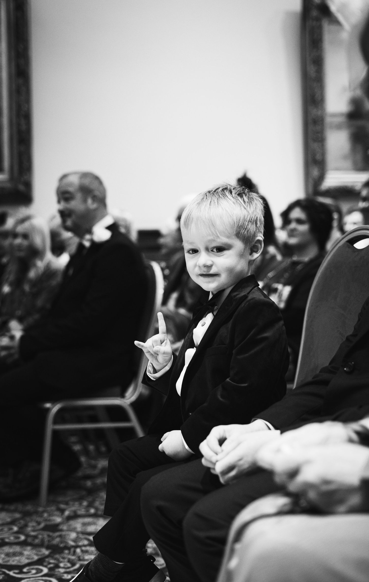 rock n roll wedding, black and white baby photo doing rock n roll hand sign, Liverpool wedding, candid, documentary style