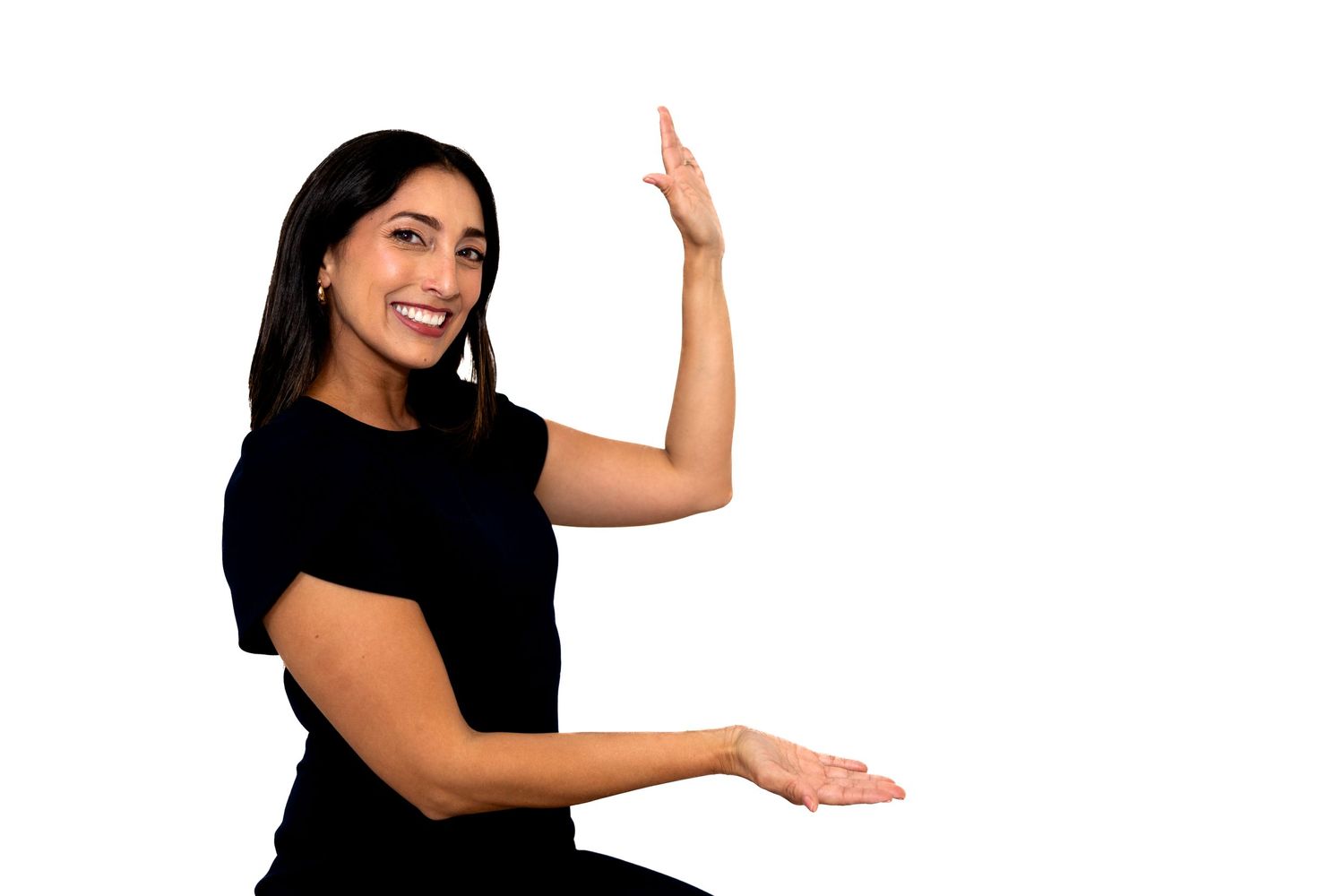Person in black shirt gesturing expressively with hands against white background.