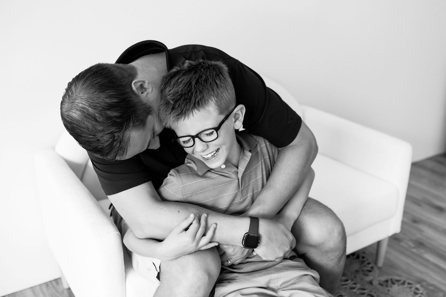 A black and white image collage showing intimate moments between a couple lying together.