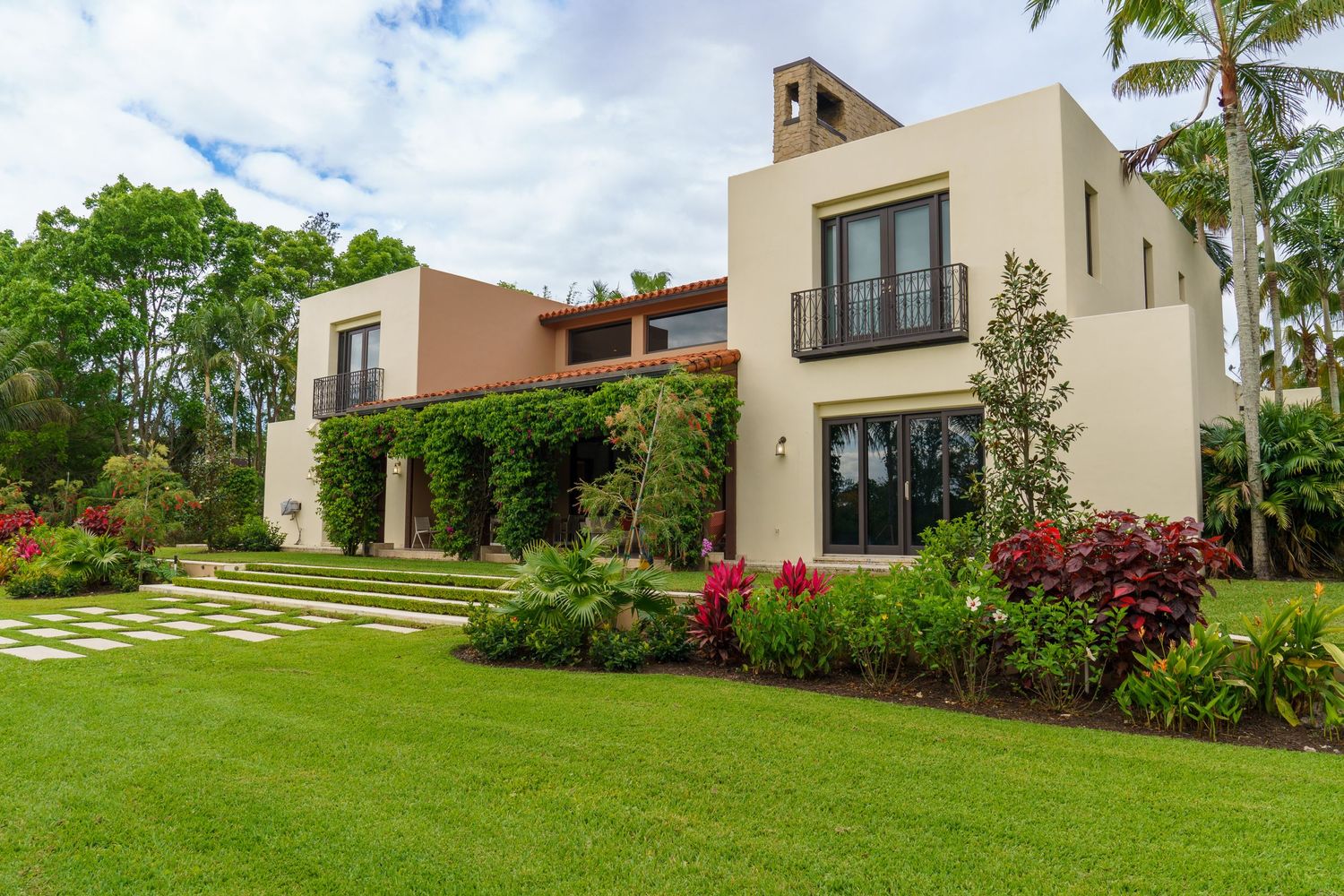 Bright exterior of a South Florida home with wide-angle view and natural light, professional real estate listing photo by SRX Media