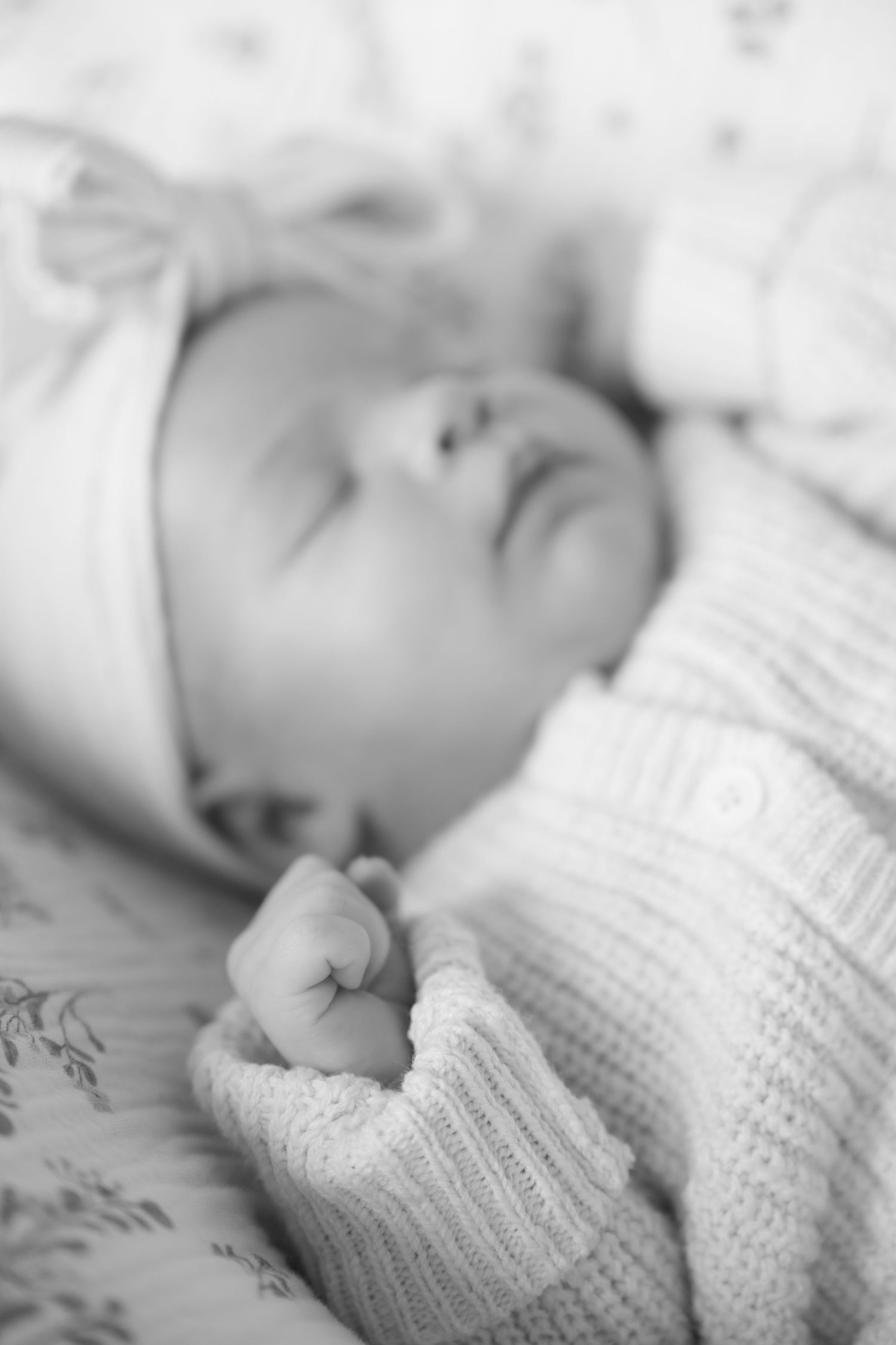 black and white of newborn baby asleep during in-studio lifestyle newborn session in stillwater, mn