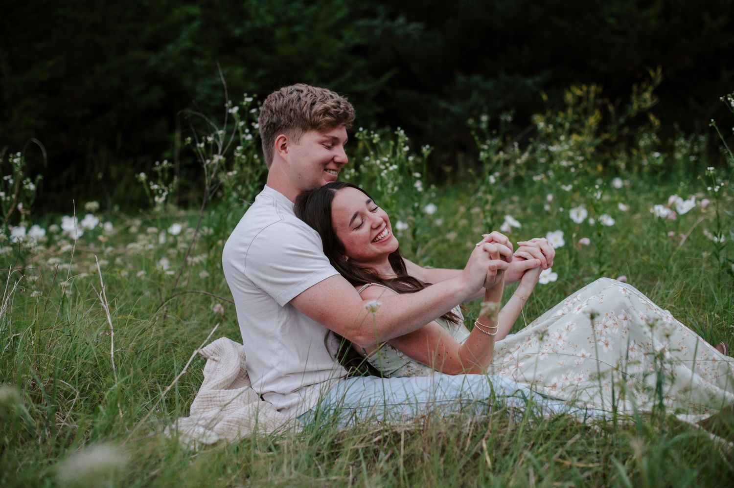 Wichita KS outdoor engagement photos in nature location Andover, couple photos in field with flowers, small elopement wedding photographer