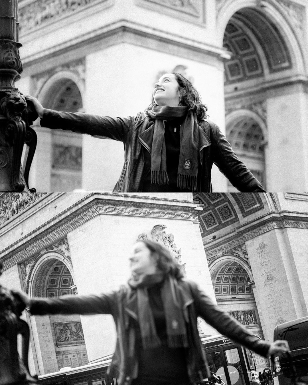 Black and white photo of a woman posing with arms outstretched at the Arc de Triomphe in Paris.