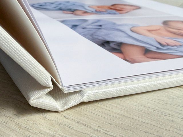 Linen photo book of new born baby boy, Auckland photography studio,