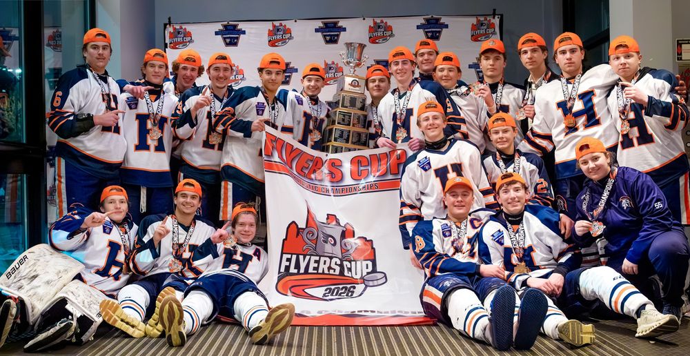 Hershey Trojans ice hockey team with the Flyers Cup championship banner, by Deanna Fox, SportsFox Photography, Hershey PA