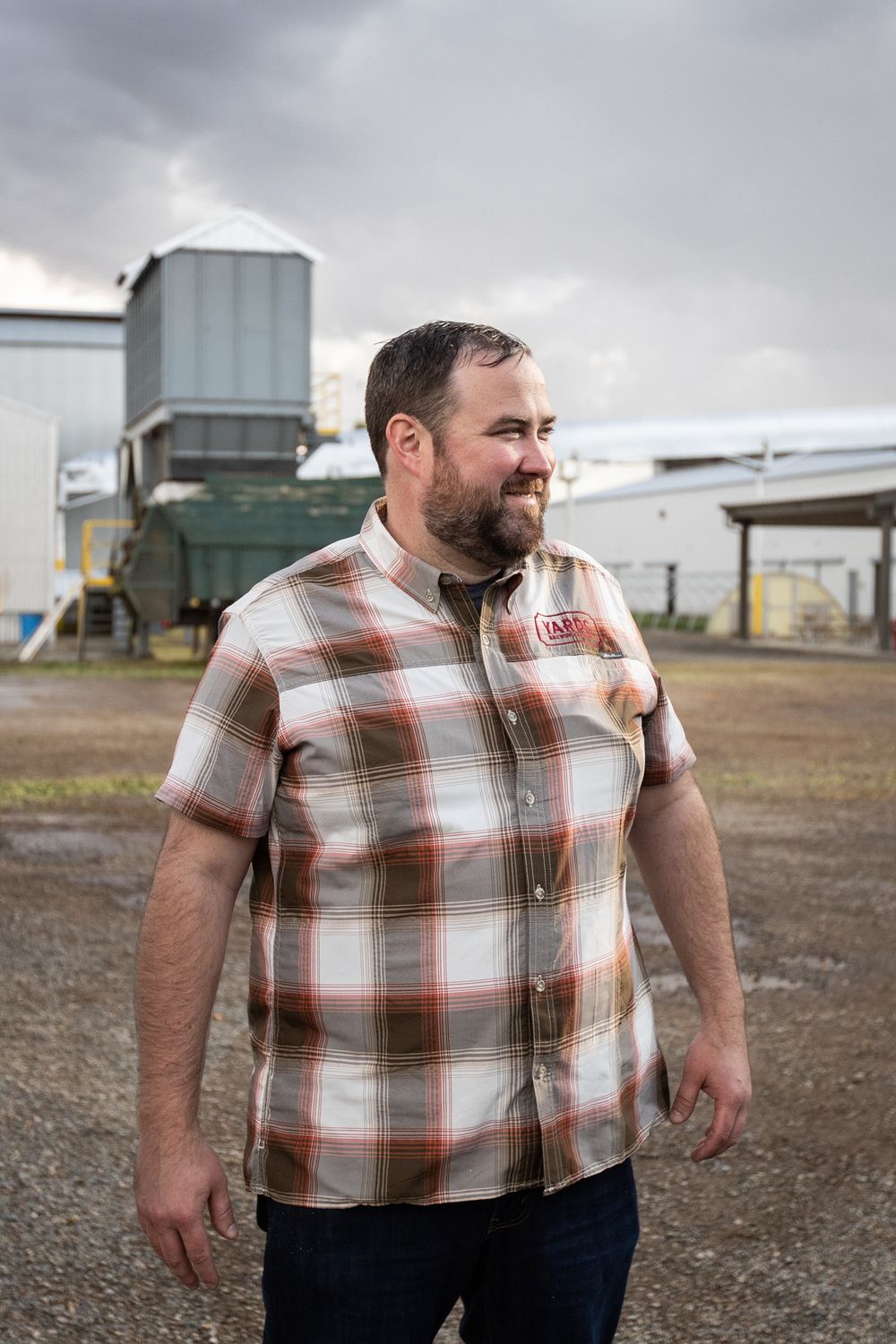 A sequence of photos shows a person in a plaid shirt standing in an industrial outdoor setting on an overcast day.