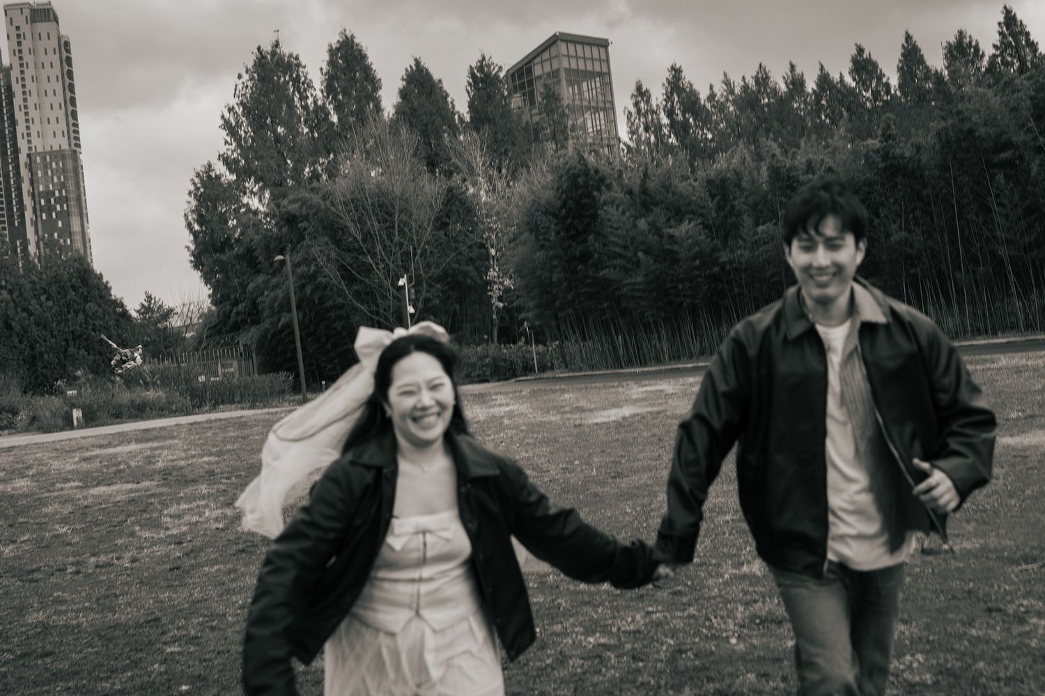 Black and white photo collage of people outdoors in casual attire showing different expressions and poses.
