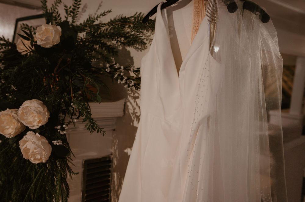 Wedding dress details with floral arrangements and delicate decor elements.