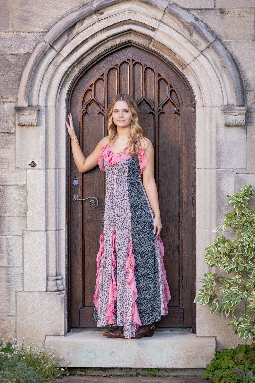 Fashion photo series showing a floral and polka dot dress against gothic stone church doorways and arches.