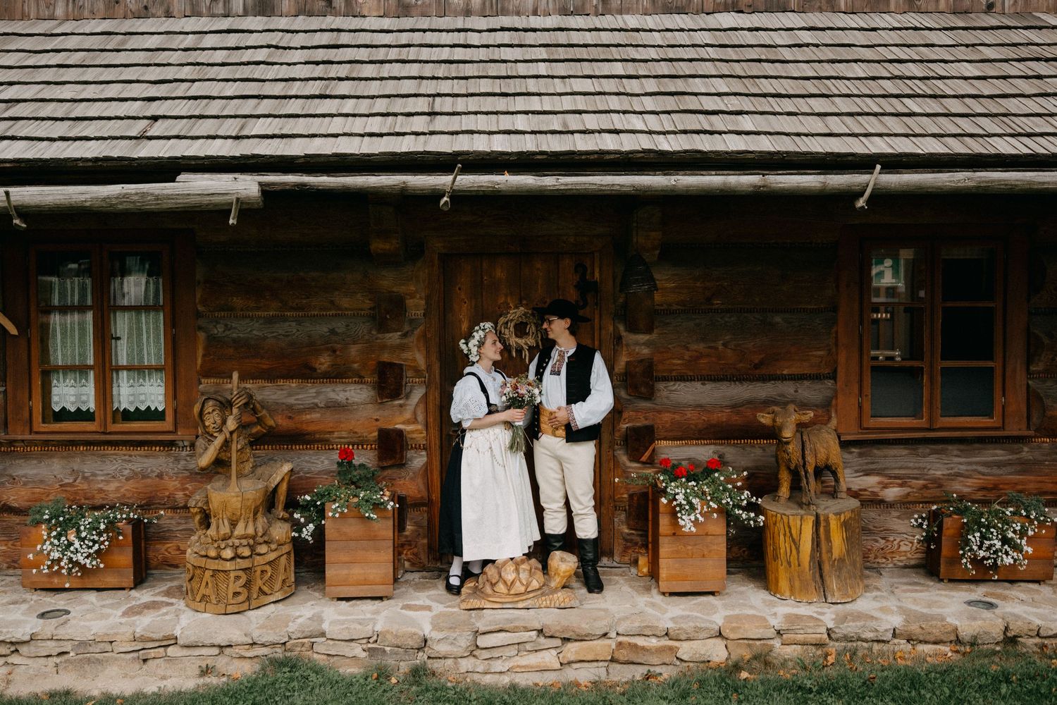 Rustic wooden lodge exterior with traditional alpine architecture.