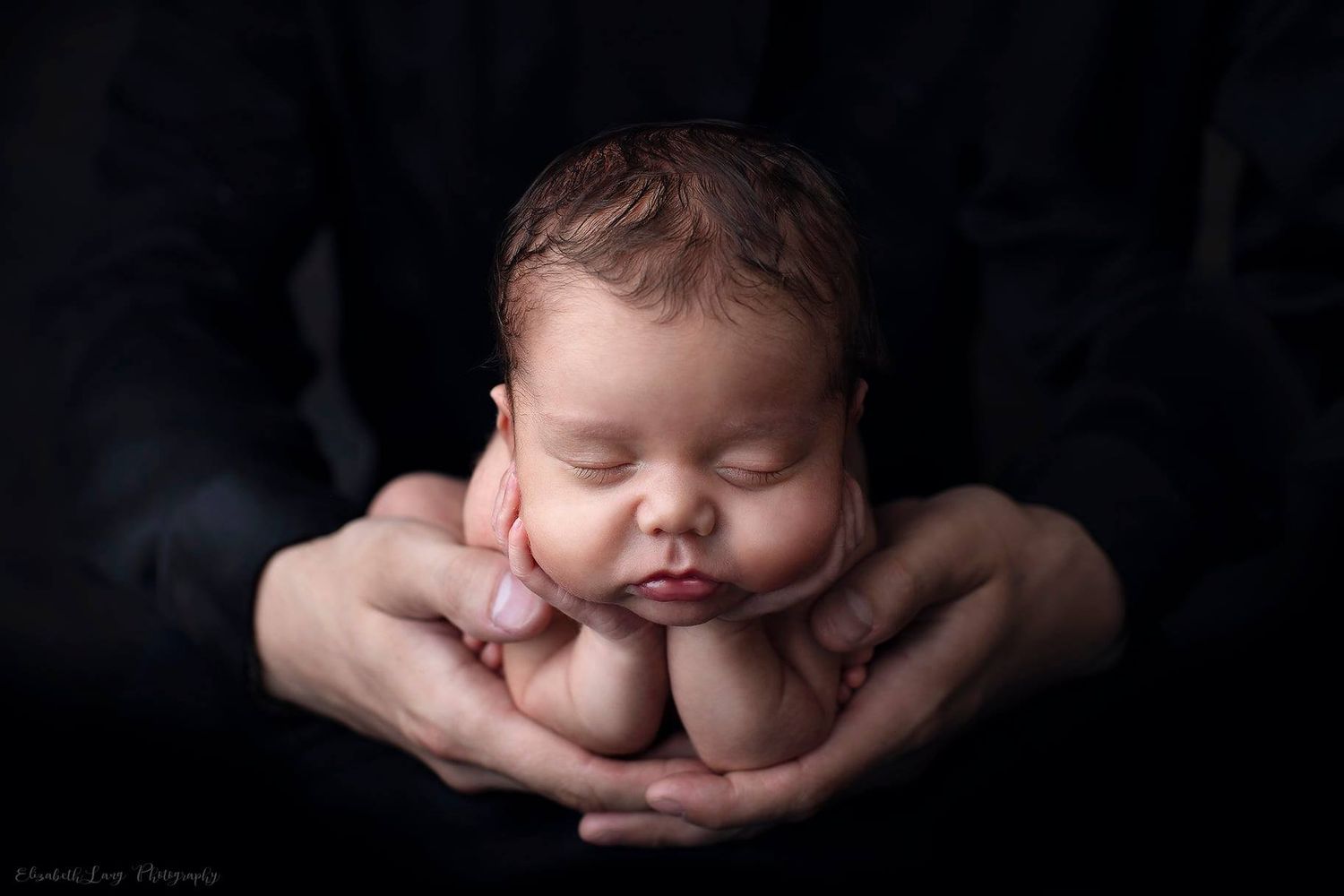 A series of artistic black and white newborn baby portraits showing peaceful sleeping poses in professional lighting.
