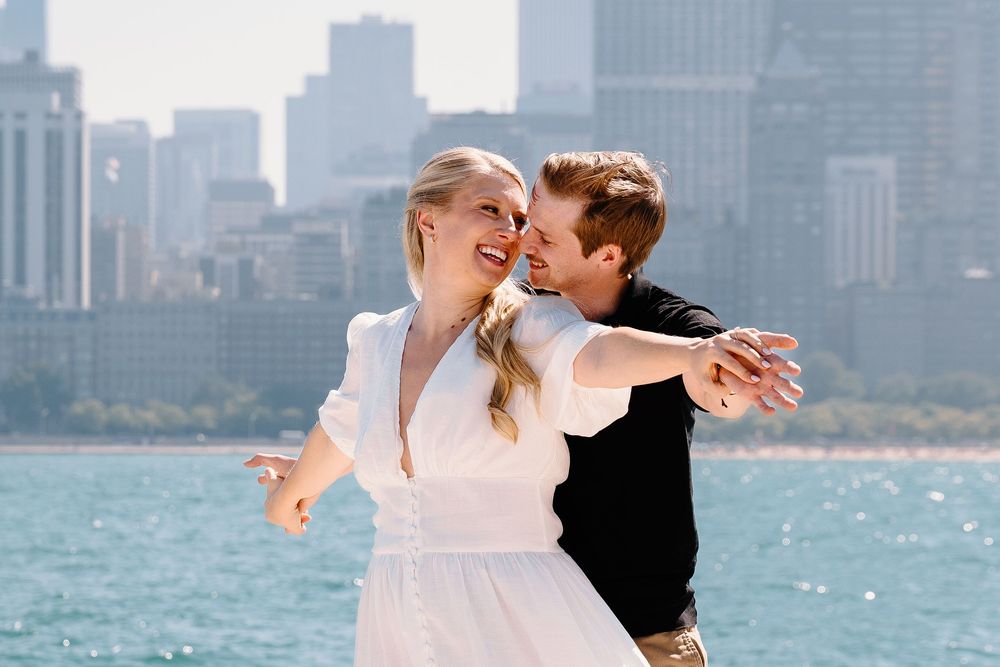 A romantic sequence of photos with a city skyline backdrop near the water.