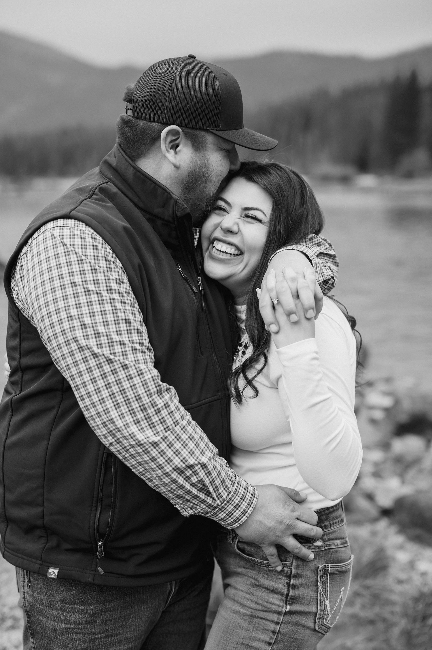 Cinematic lake engagement photos in the rain
